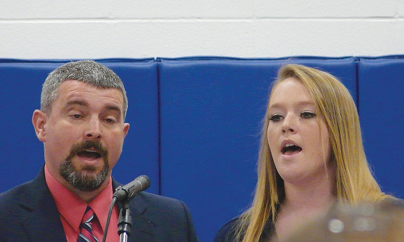 Russellville Senior Kaley Payne and her father, Jeff,  sings "Amazing Grace (My Chains Are Gone)" during Baccalaureate held Sunday evening.