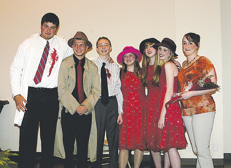 The Wood Place Library Mystery Dinner Theater Director Tiffany Brown, far right, with cast members. 