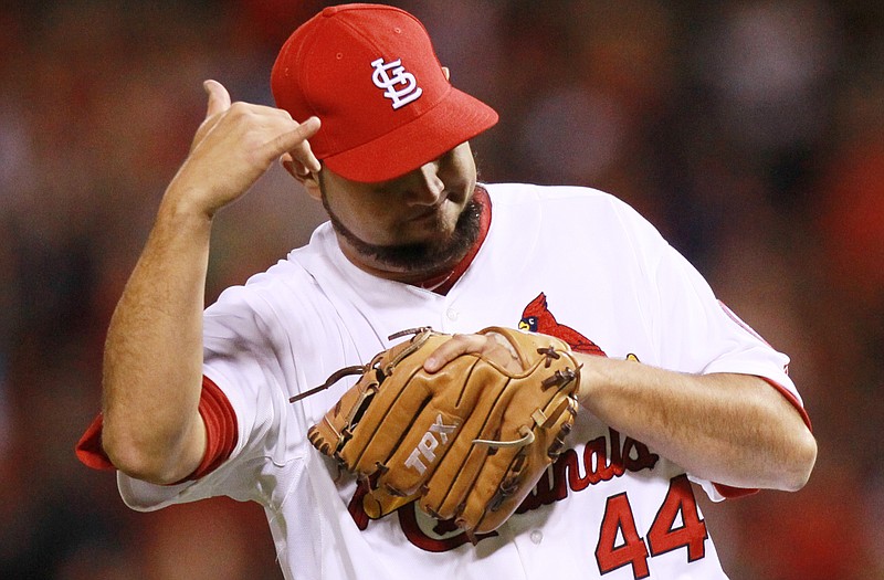 Cardinals relief pitcher Edward Mujica celebrates after getting Rick Ankiel of the Mets to fly out to end Wednesday night's game at Busch Stadium.