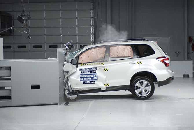 This undated image provided by the Insurance Institute for Highway Safety shows a 2014 Subaru Forester during a small overlap frontal crash test. Subaru's 2014 Forester is one of only two of 13 small SUVs that are getting passing grades in front-end crash tests done by the Insurance Institute for Highway Safety. Popular models such as the Honda CR-V, Ford Escape and Jeep Wrangler received only "marginal" or "poor" ratings from the Insurance Institute for Highway Safety. 