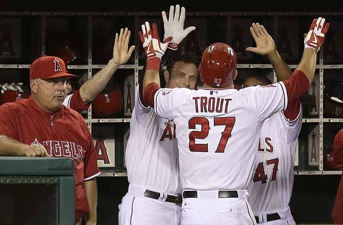 Los Angeles Angels' Mike Trout celebrates his home run against the Kansas City Royals during the eighth inning of a baseball game in Anaheim, Calif., Wednesday, May 15, 2013.