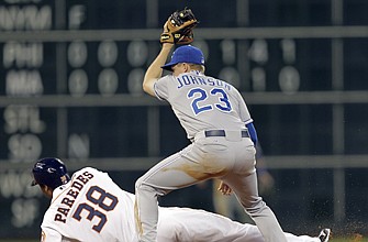 Jimmy Paredes of the Astros is picked off at second base as Royals shortstop Elliot Johnson applies the tag in the sixth inning of Tuesday night's game in Houston.