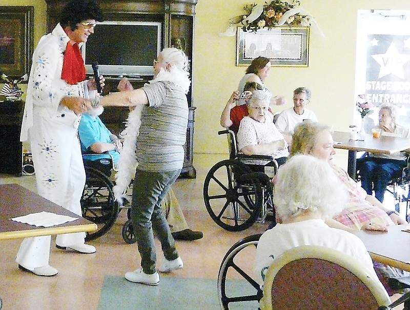 Resident Mary Ross enjoyed dancing with Elvis at Viva Las Vegas held at Moniteau Care Friday, May 17.
