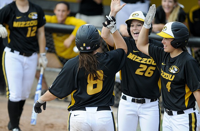 Nicole Hudson celebrates with her teammates after hitting a two-run home run during regional action against Hofstra last Sunday in Columbia.