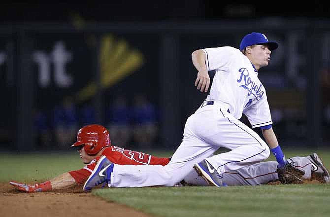 Los Angeles Angels' Mike Trout (27) steals second base while Kansas City Royals second baseman Chris Getz (17) stops the ball during the eighth inning of a baseball game at Kauffman Stadium in Kansas City, Mo., Thursday, May 23, 2013.
