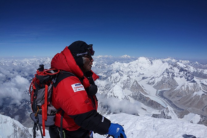 Eighty-year-old Japanese extreme skier Yuichiro Miura, who has had four heart operations in recent years, stands Thursday atop the summit of Mount Everest as he becomes the oldest person to climb the world's tallest mountain. Miura also conquered the 29,035-foot peak when he was 70 and 75.
