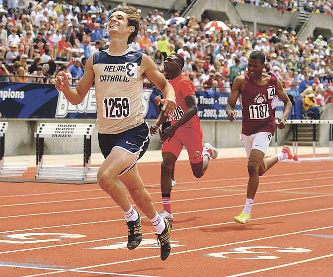 Helias' Griffin McCurren is all smiles as he crosses the finish line after winning the Class 3 400-meter dash Saturday at Dwight T. Reed Stadium.