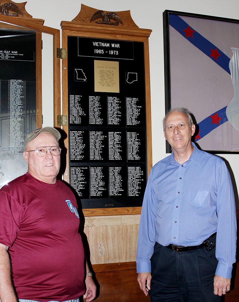 Larry Underwood, senior vice commander of Fulton Veterans of Foreign Wars Post 2657, left, and Callaway County Western District Commissioner Doc Kritzer check the restored Vietnam Memorial inside the Callaway County Courthouse. The new large plaque includes the names of 55 more Callaway County residents who served in Vietnam that were not included when the original memorial was dedicated in the early 1980s. A total of 252 Callaway County residents served in Vietnam and 11 were killed in combat.
