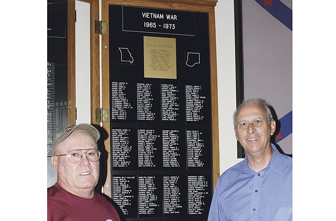 Larry Underwood, senior vice commander of Fulton Veterans of Foreign Wars Post 2657, left, and Callaway County Western District Commissioner Doc Kritzer check the restored Vietnam Memorial inside the Callaway County Courthouse in Fulton, Mo.