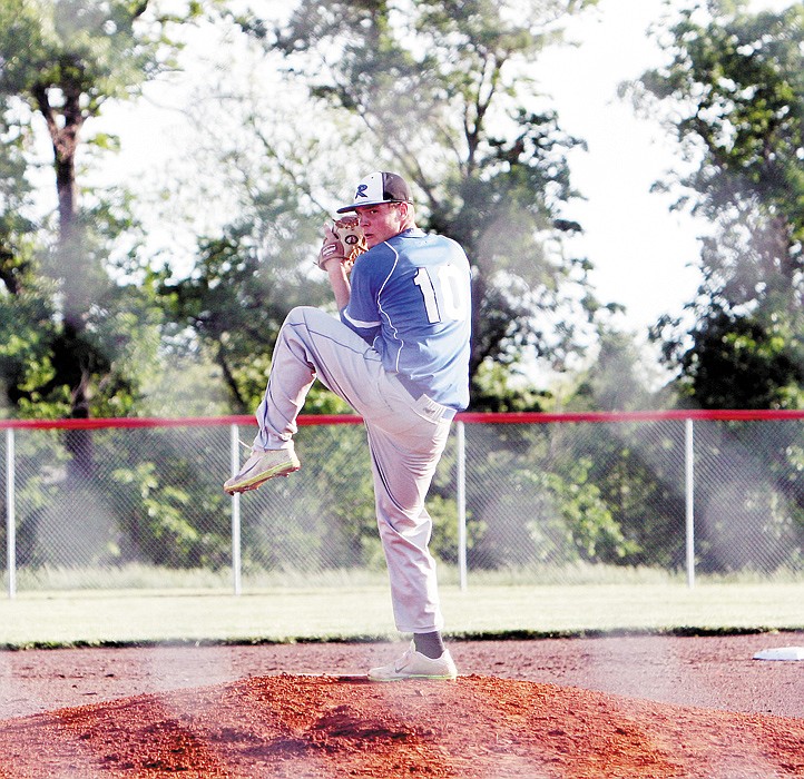 Russellville's Chandler Wolf releases a pitch during the third inning of the Indians' Class 2 Sectional game against the Harrisburg Bulldogs May 21 at Harrisburg. 