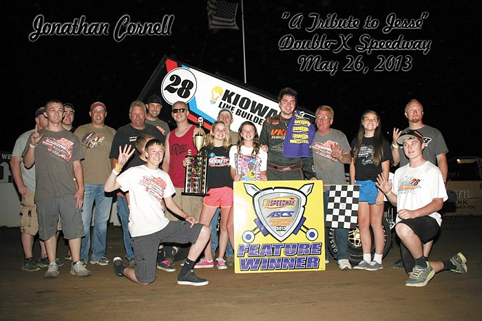 Jonathan Cornell, Sedalia, celebrates with friends and family in victory lane after winning the ASCS Warrior event in honor of Jesse Hockett Sunday night at the Double-X Speedway.