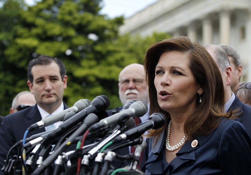 Rep. Michele Bachmann, R-Minn. chair of the Tea Party Caucus, speaks on Capitol Hill in Washington, Thursday, May 16, 2013, during a news conference with Tea Party leaders to discuss the IRS targeting Tea Party groups. Sen. Ted Cruz, R-Texas is at left