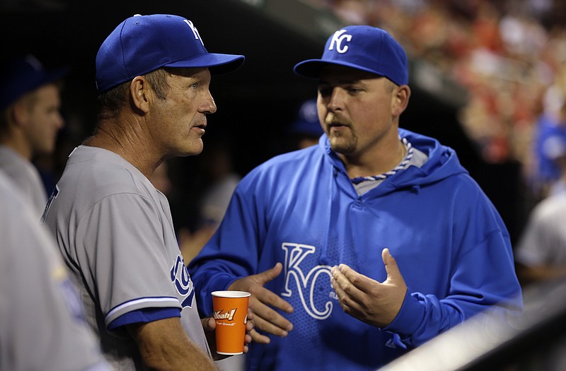 Interim Royals hitting coach George Brett talks to Billy Butler during Thursday night's game against the Cardinals at Busch Stadium.