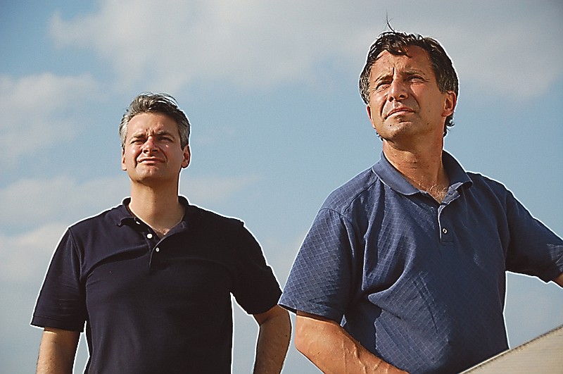 This photo provided by The Discovery Channel shows Carl Young, left, and Tim Samaras watching the sky. 
both men were killed along with Tim's son, Paul Samaras,  on Friday in Oklahoma City.