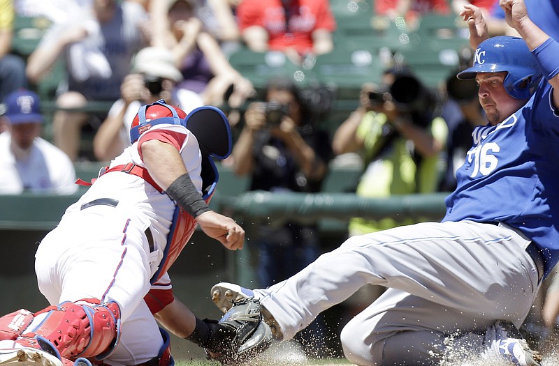 The Royals' Billy Butler (16) is tagged out at home plate by Rangers catcher Geovany Soto during the second inning Sunday in Arlington, Texas.