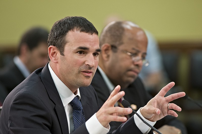 Danny Werfel, the new acting commissioner of the Internal Revenue Service, answers questions from the House Appropriations Subcommittee on Financial Services and General Government as investigations continue by the Republican-controlled House into the extra scrutiny the IRS gave tea party and other conservative groups that applied for tax-exempt status, on Capitol Hill in Washington, Monday, June 3, 2013. Treasury Inspector General for Tax Administration J. Russell George, also a witness, is seated at right. 