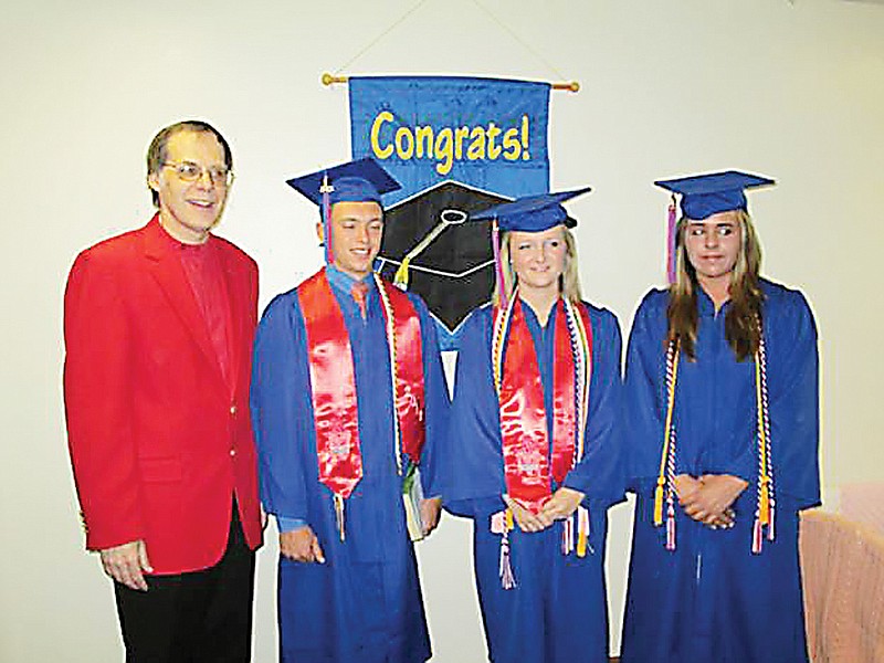 Pastor Peter Kurowski, left, with California High School graduates Garret Baquet, Audrey Imhoff, and Taylor Jenkins.