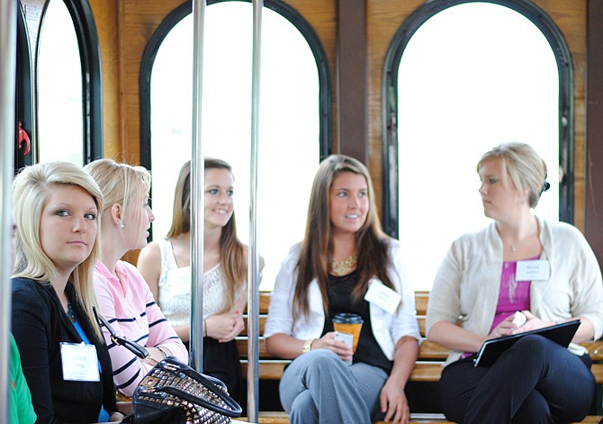 Kayla Wilbers, right, with Huber and Associates, chats with interns Thursday during a trolley ride as part of the Jeff City START program, which seeks to educate interns on the social and employment opportunities in the Capital City.
