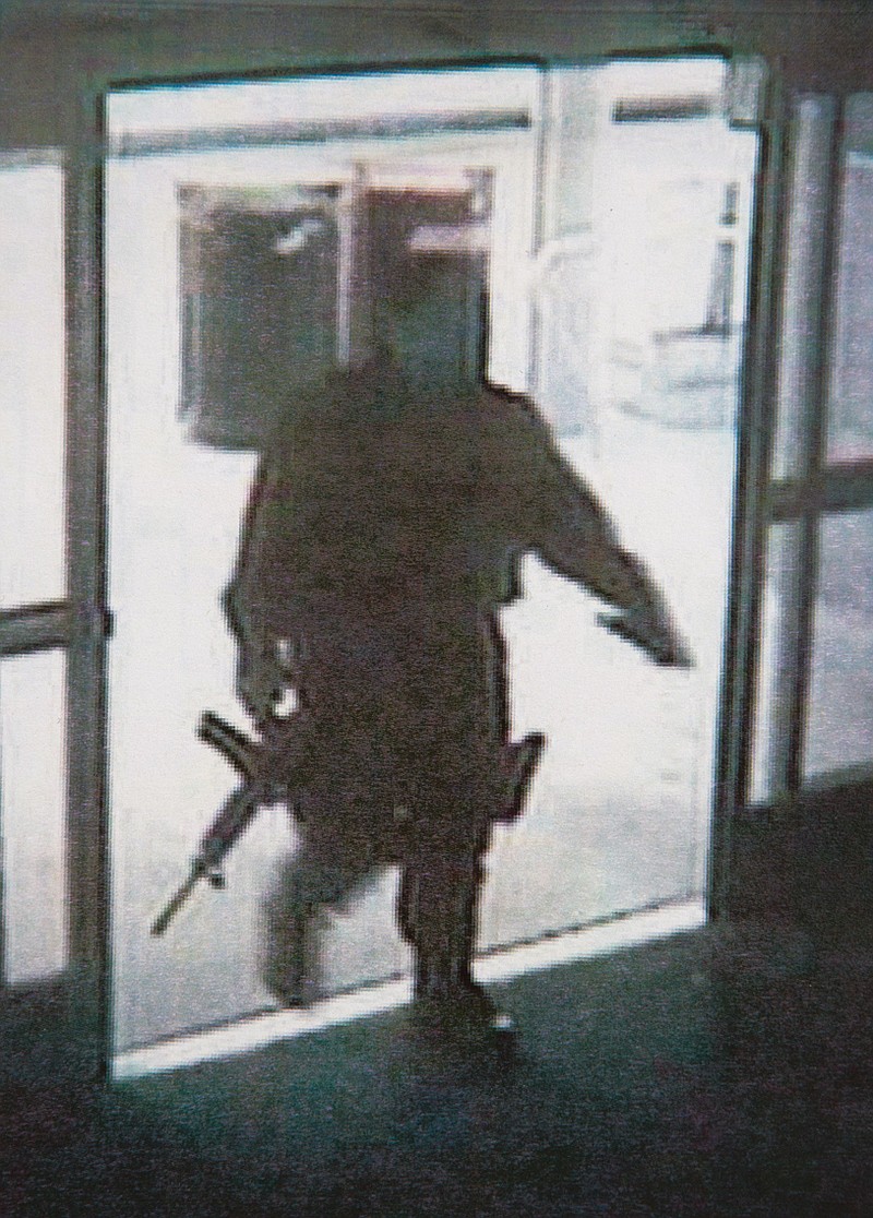 This photo provided by the Santa Monica Police Department shows a frame grab from a surveillance camera revealing the suspect entering Santa Monica College Friday, in Santa Monica, Calif. 