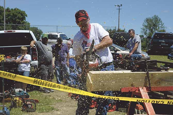 The chainsaw contest is an annual event at the Russellville Frog Leg Festival and Engine Show. John Otto earned his first win Saturday using one of several chainsaws he has built. 
