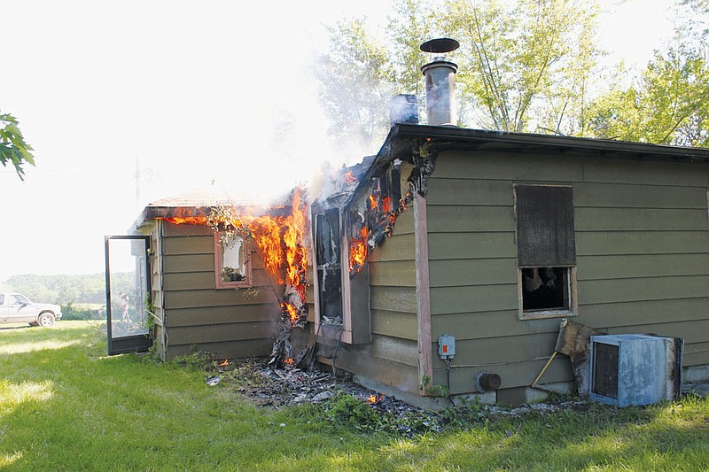 This home in the 4500 block of County Road 217, seen flaring back up under the supervision of owners Mike and Scott Gilbert, was a total loss in a fire that the Callaway County Sheriff's Office suspect was intentially started. Any with information are encouraged to call CCSO at (573) 642-7291 or Crime Stoppers at (573) 592-2474. Anonymous tips can also be made through the Callaway County Sheriff's Office Website at www.callawaysheriff.org by selecting the Crime Tips tab.