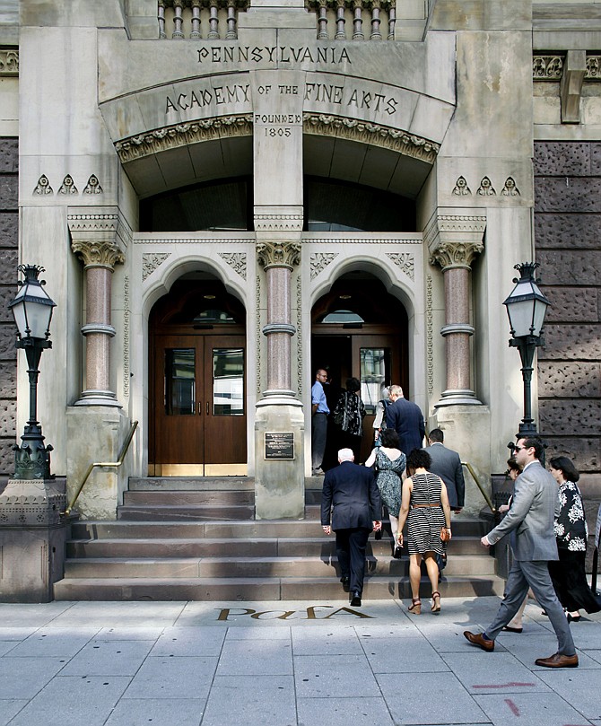 People attend a public memorial service on Sunday at the Pennsylvania Academy of the Fine Arts for Anne Bryan who was among the victims of the fatal building collapse in Philadelphia on last week.