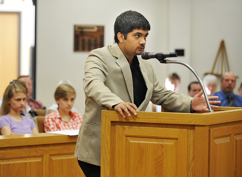 Jay Patel tries to make his case to open a package liquor store at 1931 W. Main St. He spoke in favor while a number of attendees spoke out against the store at the Board of Adjustment meeting in City Hall early Tuesday morning. Ultimately, the vote did not go his way and he was denied a conditional use permit.