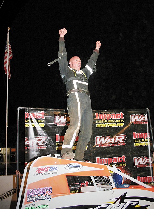 Chris Parkinson, Gladstone, celebrates his feature win in the Wingless Auto Racing Series Sunday night at the Double-X Speedway. 