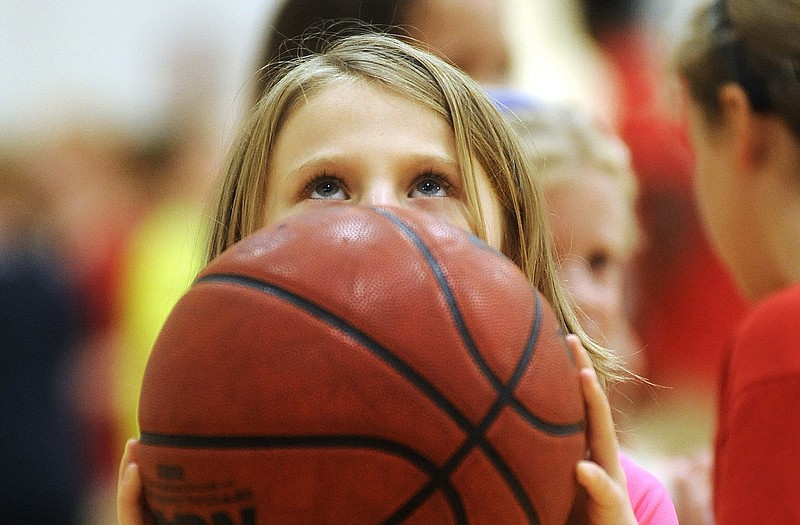 Immaculate Conception third grader Elie DeFeo sights in on the rim before taking a shot from the foul line while participating in the Lady Jays summer basketball camp Wednesday at Fleming Fieldhouse.