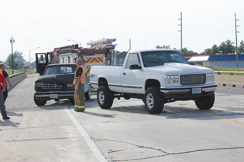The Route F overpass crossing U.S. Highway 54 was closed temporarily around 6 p.m. Thursday after the east-bound lane was blocked by a two-vehicle accident between an older Ford pickup and a 2000s GMC 1500. The drivers and passengers of both trucks said they were uninjured and refused ambulance treatment, although the Ford was leaking antifreeze and needed to be towed. Fulton Fire officials directed traffic and ensured safety while the Fulton Police Department investigated.