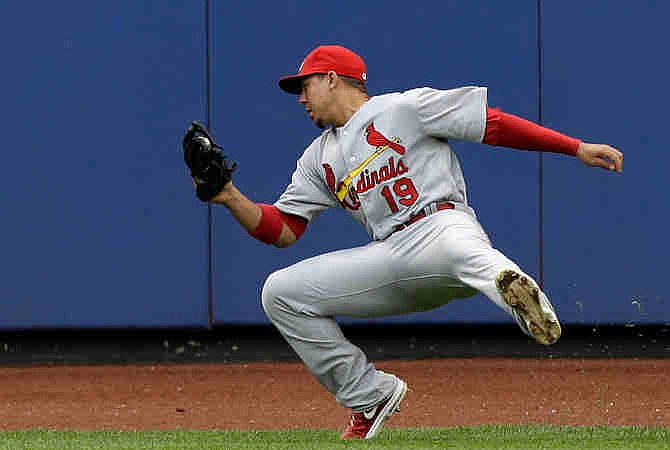 St. Louis Cardinals center fielder Jon Jay (19) fields New York Mets' Jordany Valdespin's sixth-inning flyout near the warning track in a baseball game in New York, Thursday, June 13, 2013. 