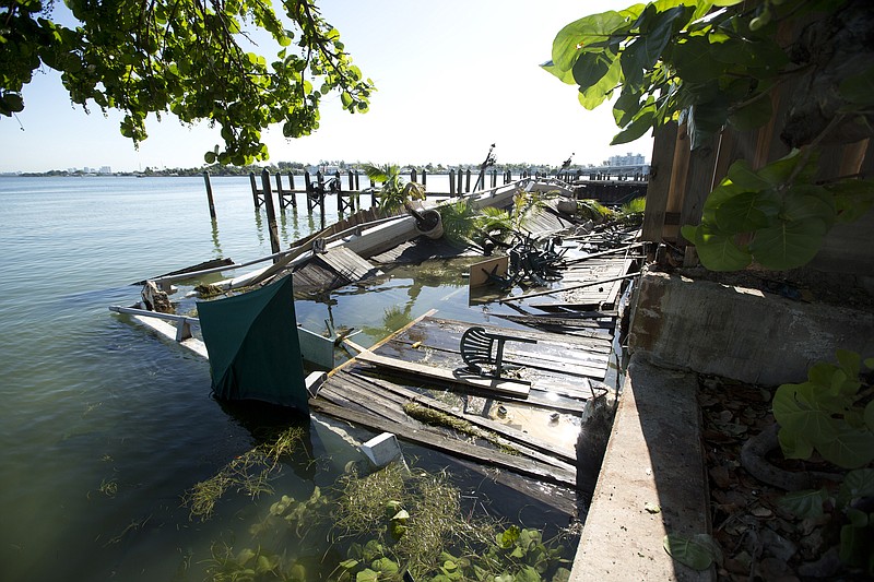 An outdoor deck collapsed at Shuckers Bar and Restaurant, in Miami, Fla. The packed outdoor deck behind the popular Miami-area sports bar partially collapsed during the NBA Finals on Thursday night, sending dozens of patrons into the shallow waters of Biscayne Bay.