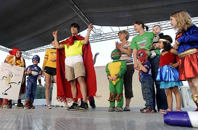 Alex Weaver, center, steps to the front of the stage to raucous cheers while announcing himself as Captain Underpants during the Relay For Life event June 7, 2013, at the Jefferson City Jaycees Fairgrounds. Weaver was representing team Too Inspired To Be Tired, a group comprised of close-knit sophomores from Jefferson City High School.