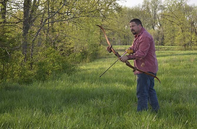Brandon Butler picks a spot while handling a heavy and quiet recurve bow.