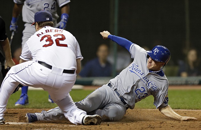 Elliot Johnson of the Royals slides home to score from third on a wild pitch by Indians relief pitcher Matt Albers in the ninth inning of Monday night's game in Cleveland.