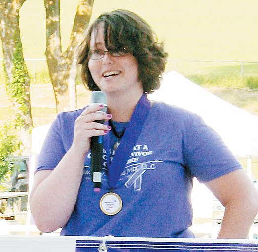 Cancer survivor Katie Imler, 21, shares her battle with cancer during the opening ceremony of the Relay For Life of Moniteau County Friday.