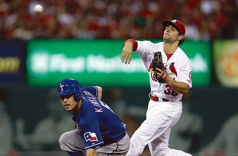 The Rangers' Ian Kinsler is out at second as Cardinals shortstop Pete Kozma fails to turn a double play during the fourth inning of Friday's game in St. Louis.