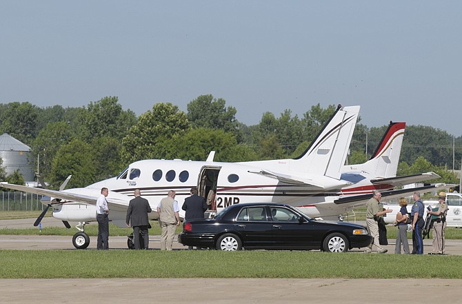 Gov. Jay Nixon leaves the airport in Jefferson City on June 30 using a state-owned plane. 