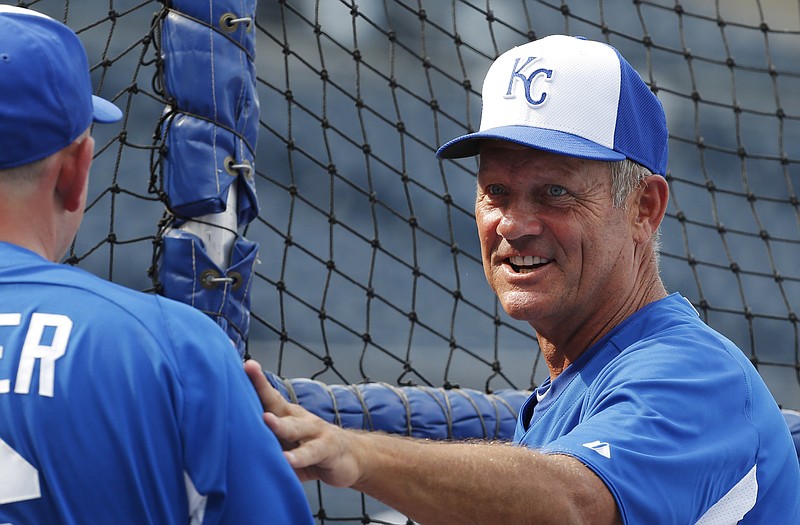 Royals hitting coach George Brett talks with Billy Butler prior to a game last week at Kauffman Stadium.
