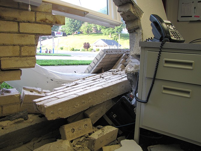 A disturbance ended Monday morning when a car struck the Red Cross office building. 