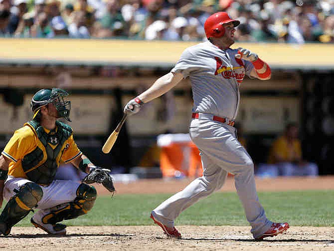 St. Louis Cardinals' Matt Adams hits a three-run home run off Oakland Athletics' Jerry Blevins in the sixth inning of a baseball game Saturday, June 29, 2013, in Oakland, Calif. 