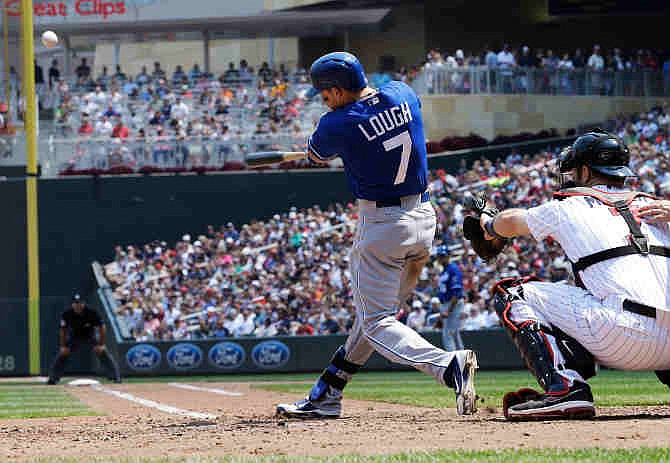 Kansas City Royals' David Lough drives in two runs with a double off Minnesota Twins pitcher Kevin Correia in the fourth inning of a baseball game, Sunday, June 30, 2013 in Minneapolis. 