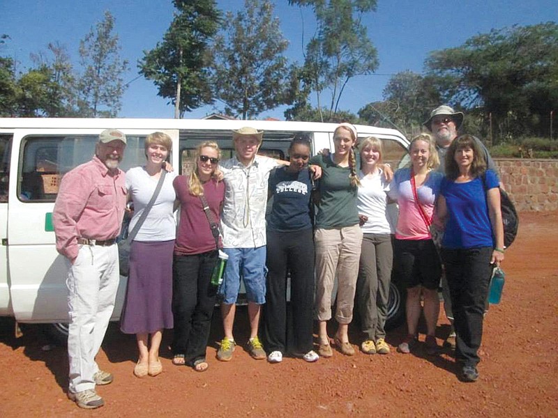 From left: Bob Hansen, Hannah Minchow-Proffitt, Keeley Cornelson, Garrett Gilbert, Sandra Nivyabandi (a Westminster College student from Rwanda who joined the group for two days), Kenna Cornelson, Jessie Perry, Jenna Teter, Cathy Hartig and Dan Harms of the recent team with the Rwanda Community Partnership pose with their van there. The group just returned from a 23-day trip to continue to oversee microloans, provide aid locals need and exchange culture.
