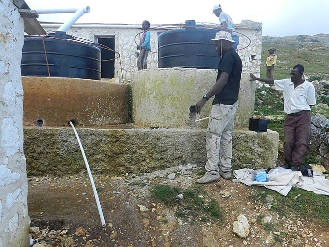 A new well is shown installed in a Haitian village thanks to Hope for Caribbean Kids and the Shoeman Water Project.