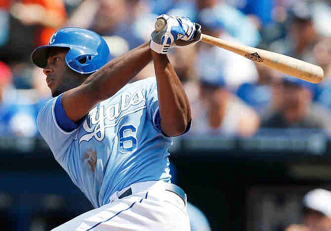 Kansas City Royals' Lorenzo Cain watches his grand slam off Cleveland Indians starting pitcher Ubaldo Jimenez during the sixth inning of a baseball game at Kauffman Stadium in Kansas City, Mo., Thursday, July 4, 2013.