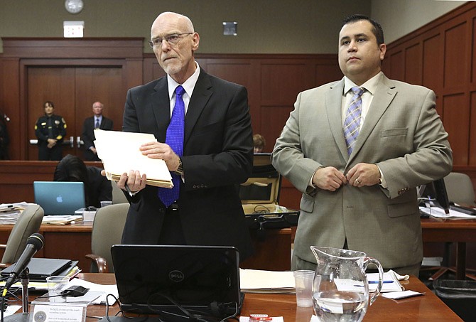 George Zimmerman, right, stands next to one of his defense attorneys, Don West, during his trial in Seminole circuit court, Friday in Sanford, Fla. Zimmerman has been charged with second-degree murder for the 2012 shooting death of Trayvon Martin. 