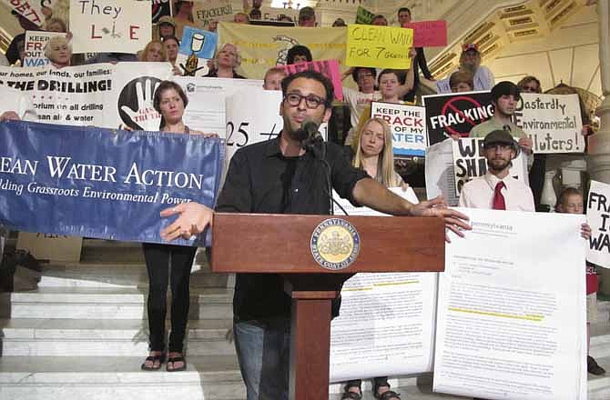 Josh Fox, director of the anti-fracking documentary "Gasland," appears at a rally in the Pennsylvania Capitol by anti-gas drilling activists to press Gov. Tom Corbett and state environmental regulators for more information about the extent of water contamination caused by the activity on Tuesday, June 18, 2013 in Harrisburg, Pa.