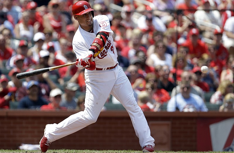 The Cardinals' Allen Craig prepares to swing during Sunday's game against the Marlins at Busch Stadium.