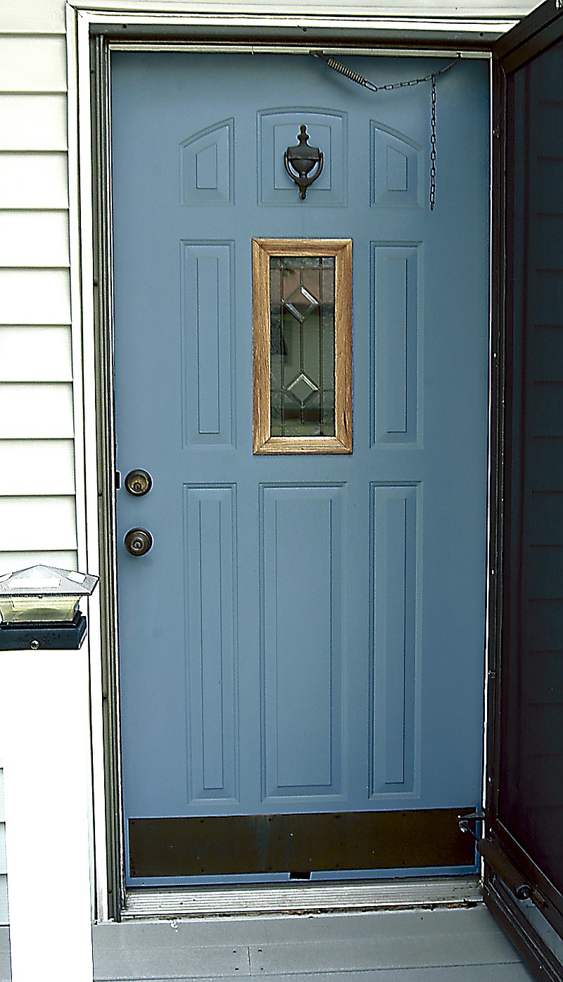 Democrat photo / David A. Wilson
The front door of the home of Randy and Kathy Porter was repainted a blue-gray after the house was resided. The old mauve paint did not go with the new siding. 