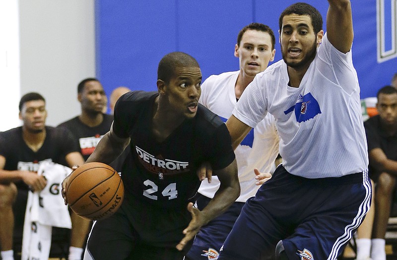 Detroit's Kim English (24) drives the baseline past Oklahoma City's Grant Jerrett during an NBA summer league basketball game Tuesday in Orlando, Fla.